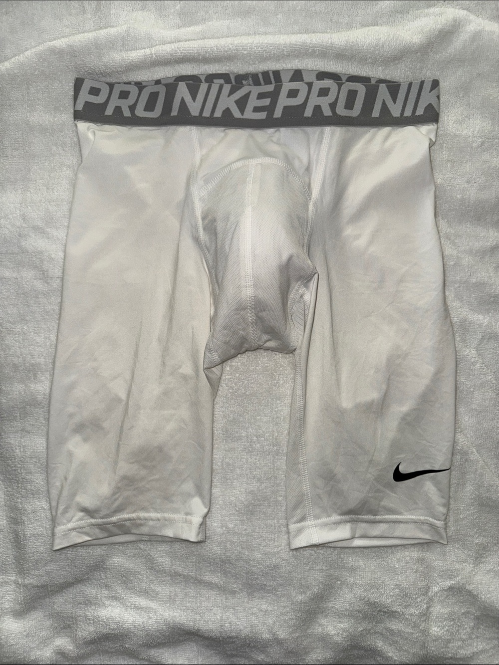 Nike White Pro Compression Shorts with Gray Waistband and Black Swoosh